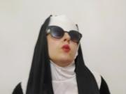 sexy nun is playing with a fake dick