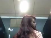 Girls shows off ass in public bathroom