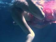 Two hot lesbians underwater touching eachother