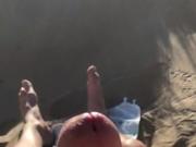 Slowmotion cumshot on naked beach