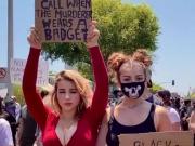 Hot blondes posing at a protest
