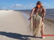 Sexy big hanging breasts dancing in a grass skirt