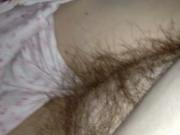 pulling on the wifes hairy pussy under the sheets