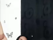 Sexy brunette undresses and touches a freshly shaved pussy