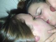 Two girls kissing and getting a facial