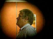 Mature man at the pisser