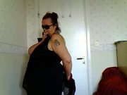 Female stripping in bedroom