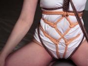 Sensitive touching in color rope bondage