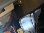 Indian woman barefoot shoe change on train