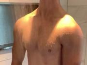 Muscular top enjoying a shower in his underwear