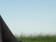 Cd rubbing stockings over cock outdoors