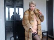 Hot sexy Russian MILF slut in a fur coat and a cigarette...