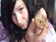 Nasty busty slut eats cum load off a cookie