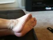 Sexy feet relaxing with toe rings