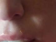 Close up cum shot into a whore mouth