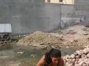 Pakistani woman taking off her clothes