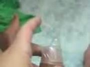 Cumshot in the cup with condom 2