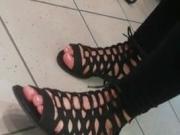 Candid girl feet in the black sandals no faceshot