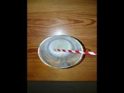 Big cumshot into a glass with a straw