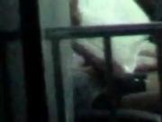 asian boy caught through his window