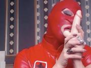 Latex Masked Redhead Practices Blowjob.