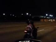 Riding a motorcycle with a skirt