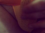 Playing with my bulge in a tiny orange mesh thong
