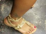 Candid ebony feet with red toes