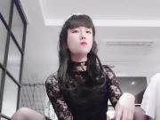 Caged Asian sissy whore riding a dildo