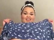 Latin SBBW lifts her dress and does some big belly teasing