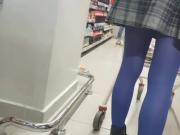 Shopper in blue pantyhose with pleated skirt