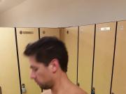 Millennial male changing in gym locker room