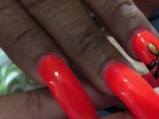 Latina with sexy long orangedifferent design nails