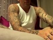 Inked stud Evan Heinze caresses feet and cock solo