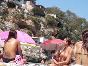 Voyeur - Big boob topless babe with friends on beach