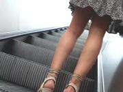 Upskirt on escalator 106