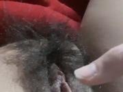 Playing with her hairy, dripping wet pussy