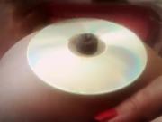 chubby girl bellybutton stuffing into a cd