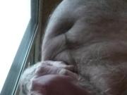 Naked in front of the window