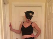 Crossdressing posing in gay cop lingerie stockings and heels