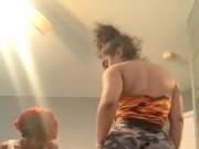 1 girl's boobs, another's bum