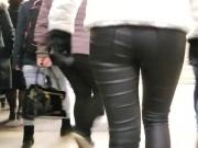 Young woman's ass in leather pants