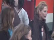 a group of girls smoking on a trainstation