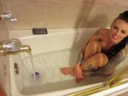 Busty starlet Christy Mack takes a bath