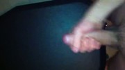 Guy shoots a big cum load while watching porn
