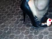 Sexy feet in black stockings and peep toes