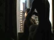 Fucking her ass in the window