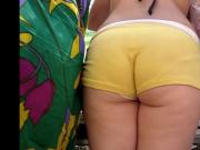 A big ass girl in yellow pants at a store