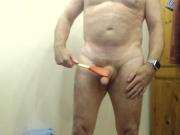 demonstrating using paddle on my ass cock & balls for master