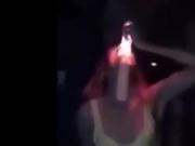 Girl deepthroats a really huge illuminated dildo